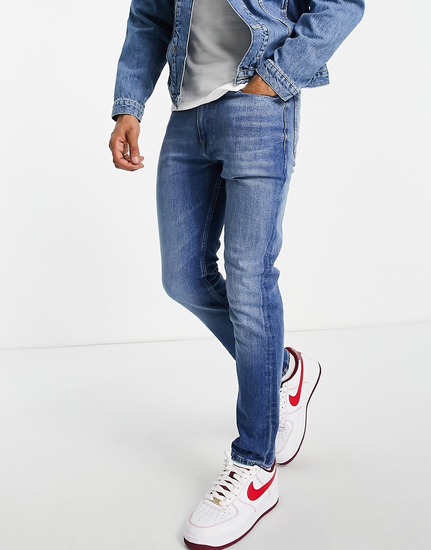 фото Светлые зауженные джинсы tommy jeans simon-голубой