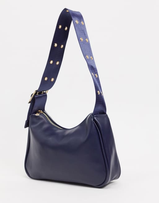 SVNX 90s shoulder bag with adjustable eyelet strap in navy ASOS