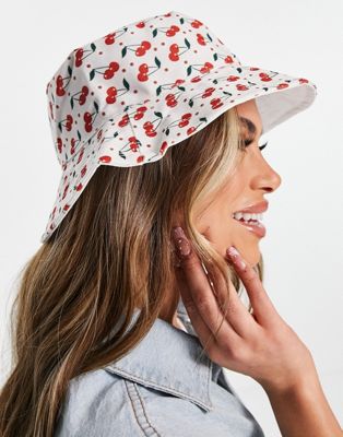 SVNX cherry print bucket hat in off white
