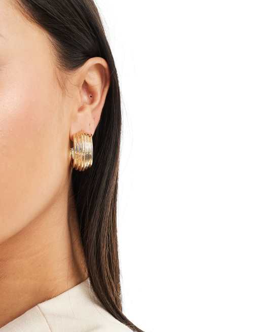 SVNX chunky hoop earrings in gold with imprinted texture