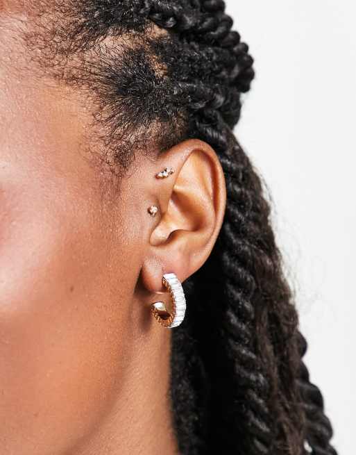 SVNX crystal huggie earrings in white and gold