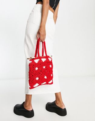 SVNX heart print braided tote bag in red