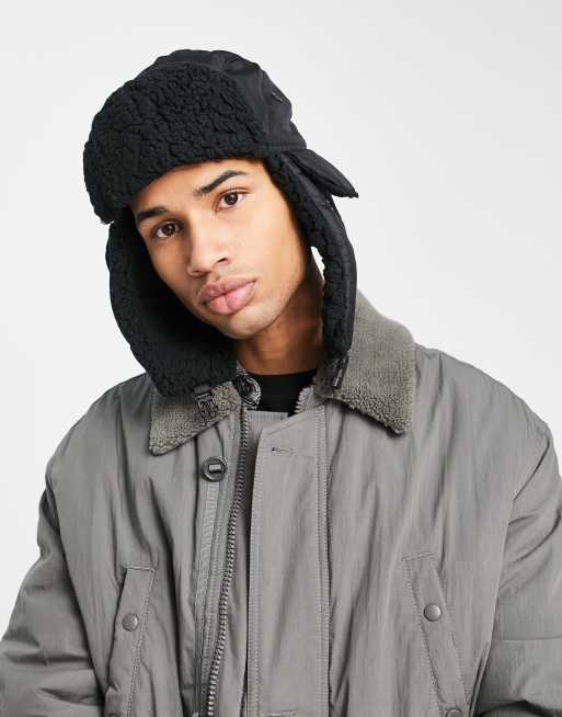 ASOS DESIGN trapper hat with badge in brown faux fur