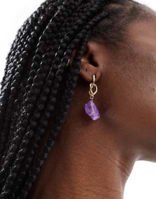 gold earrings with purple crystal detail