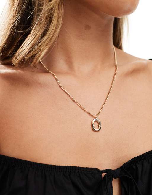 SVNX – Lange Halskette in Gold mit goldenem Anhänger 