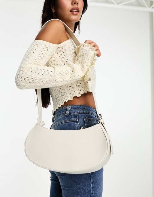 SVNX saddle bag with adjustable straps in cream ASOS