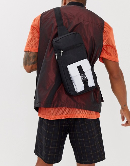 SVNX single strap cross body bag with reflective detail