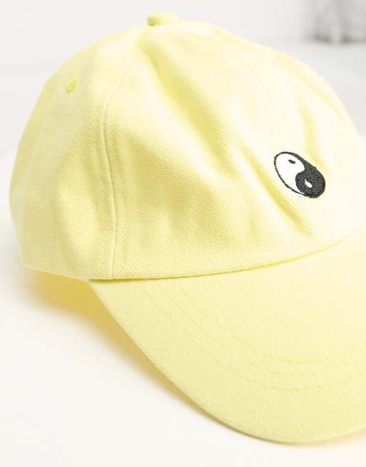 SVNX yin yang embroidered cap in lemon yellow | ASOS