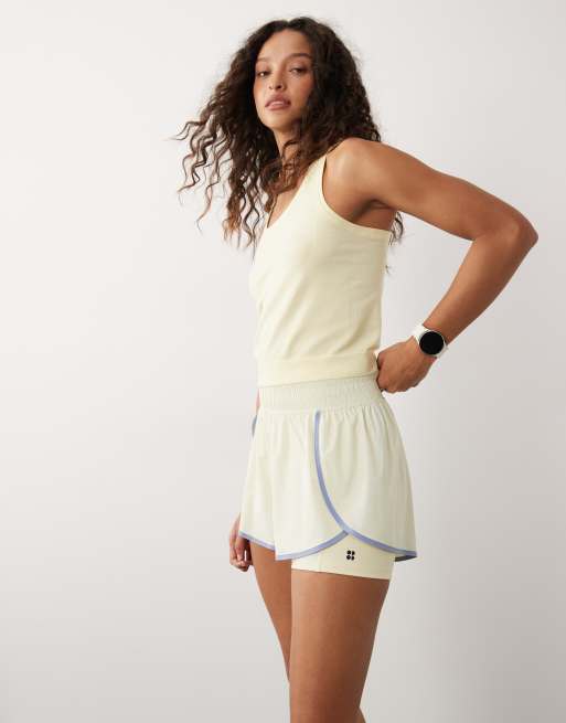 Sweaty Betty 2-in-1 multi-training shorts in yellow with contrast binding, 2 of 5