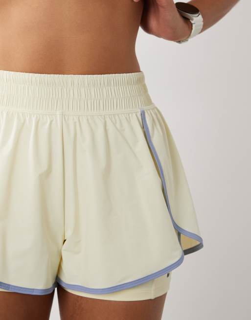 Sweaty Betty 2-in-1 multi-training shorts in yellow with contrast binding, 4 of 5