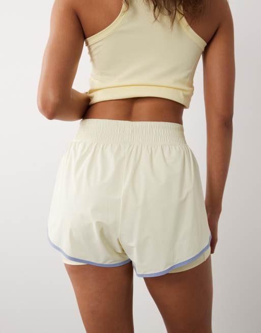 Sweaty Betty 2-in-1 multi-training shorts in yellow with contrast binding, 5 of 5