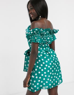 green dress with white polka dots