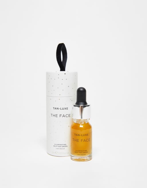 Tan Luxe - The Face i glaskugle-design