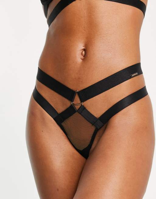 Tanga negro de malla transparente con detalle de tiras y de metal Miriam de Bluebella