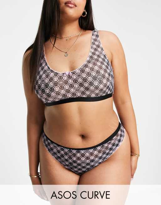 Tanga rosa y negro con diseño de emoticonos sonrientes de malla exclusivo de ASOS DESIGN Curve