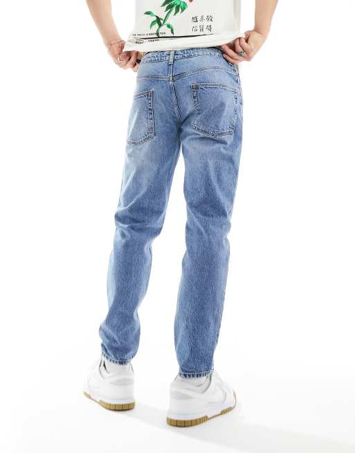 Tapered fit-jeans i let forvasket blå fra ASOS DESIGN, 3 af 5