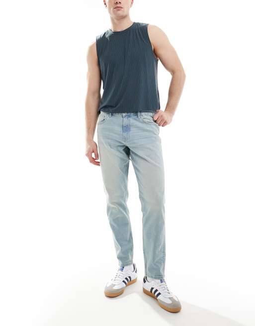 Tapered fit-jeans i let forvasket blå fra ASOS DESIGN