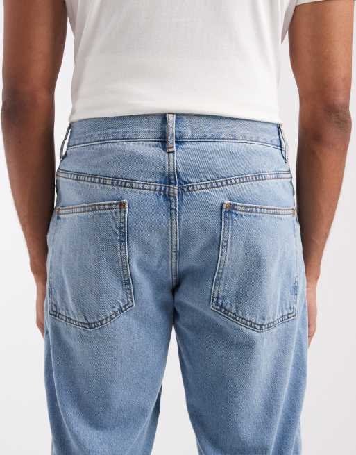 Tapered fit-jeans i let forvasket blå fra ASOS DESIGN, 4 af 5