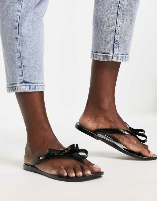 Black bow store flip flops