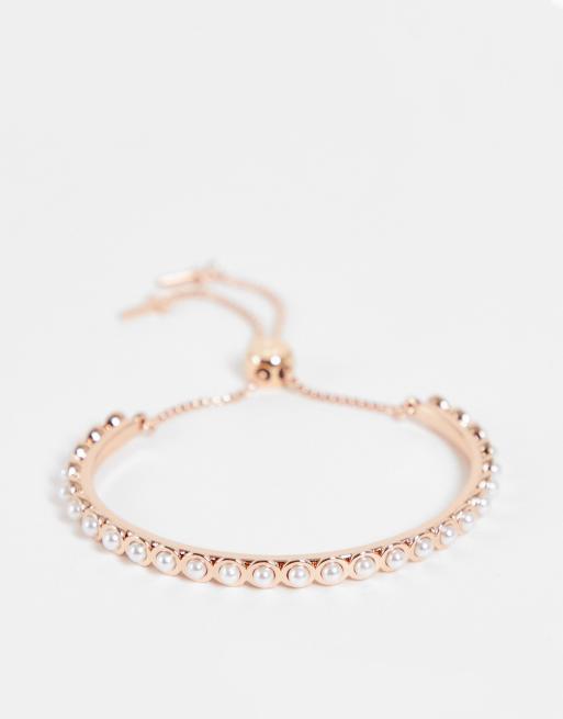 Ted Baker – Pheoni – Roséguldfärgat justerbart armband med pärlimitationer