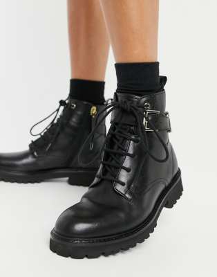 black flat tie up boots