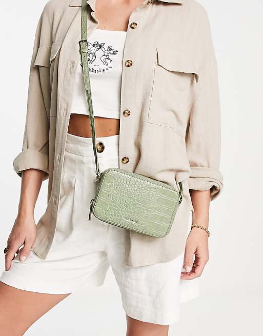 Ted Baker Stina double zip around mini bag in green | ASOS