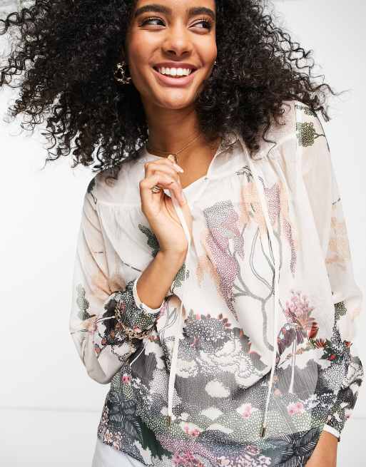 Ted Baker - Veriity - Top trasparente color avorio con stampa
