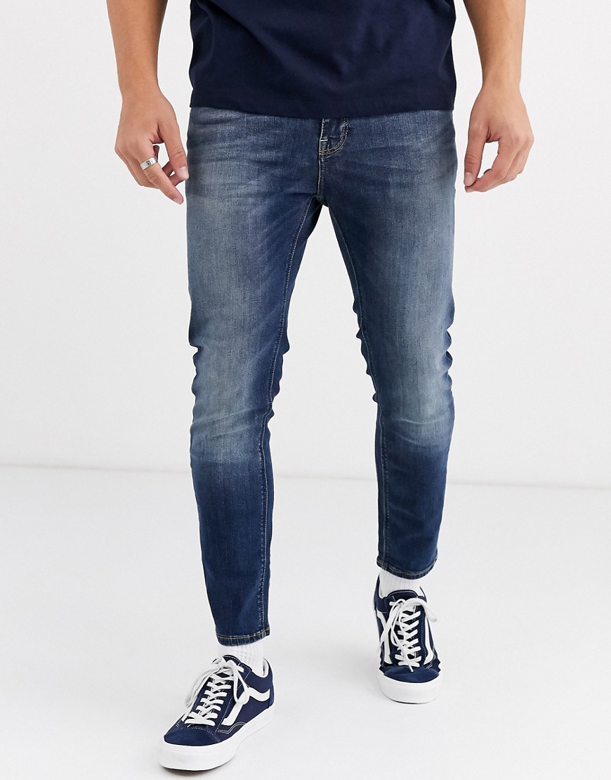 фото Темно-синие укороченные джинсы скинни asos design-синий