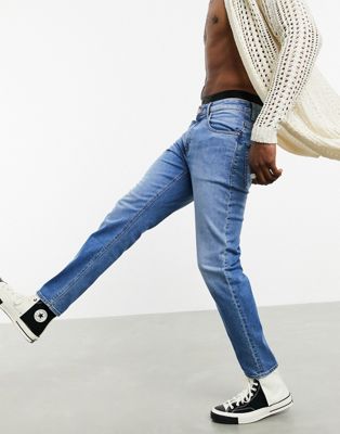 фото Темно-синие выбеленные суженные книзу джинсы из коллекции ответственной моды asos design-синий