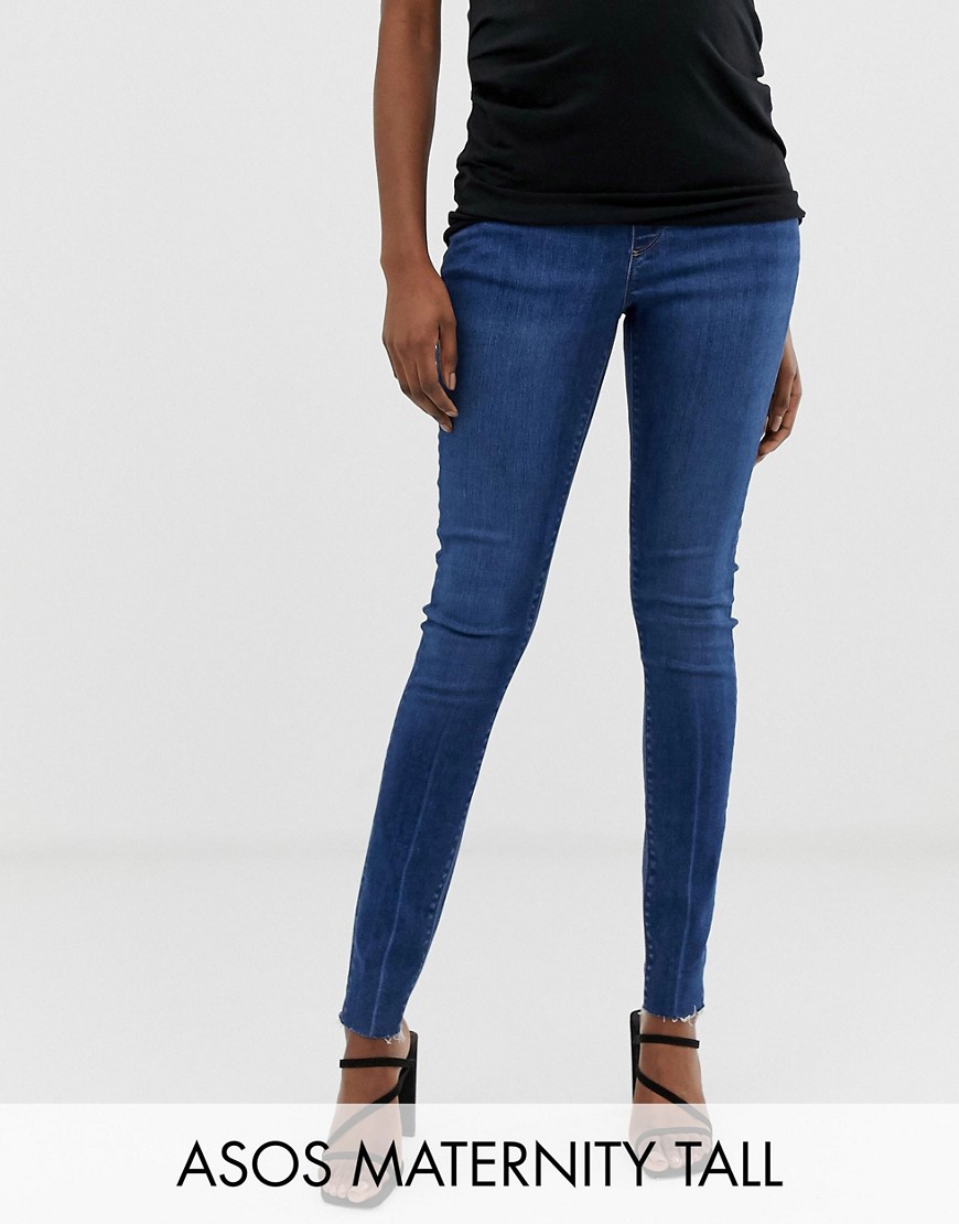 фото Темно-выбеленные джинсы скинни с посадкой под животом и необработанным краем asos design maternity tall ridley-синий asos maternity