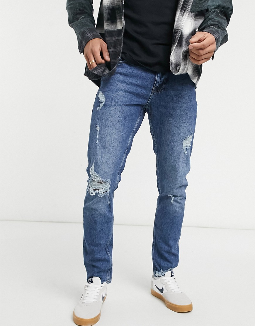 фото Темно-выбеленные узкие джинсы со рваной отделкой asos design-голубой