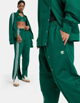 фото Темно-зеленые спортивные брюки с отделкой на кнопках adidas x ivy park-зеленый