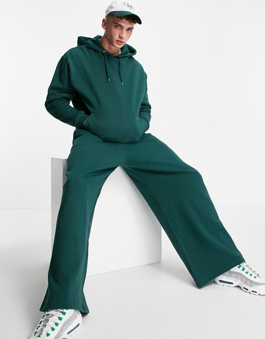фото Темно-зеленый спортивный костюм в стиле oversized из худи и джоггеров с широкими штанинами asos design-зеленый цвет