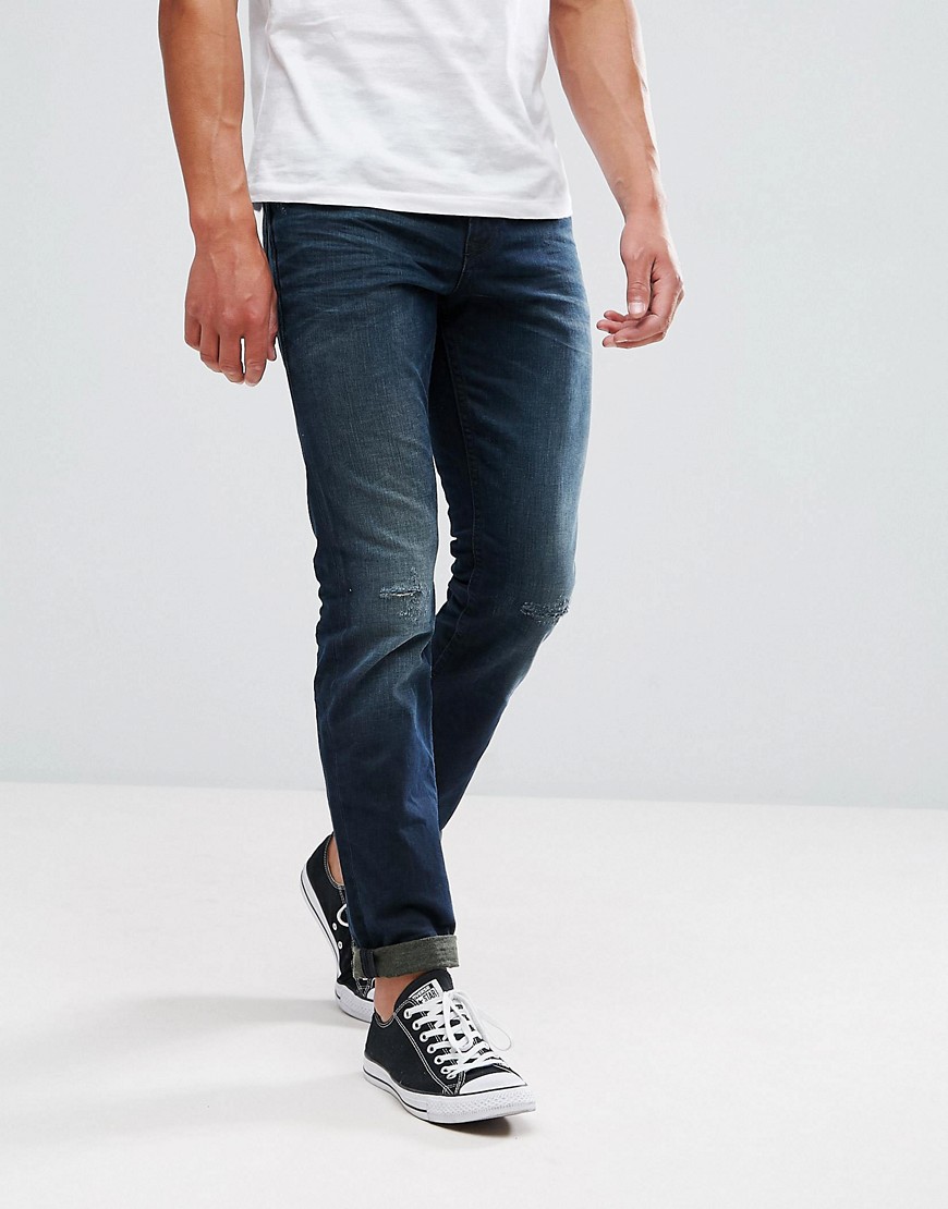 фото Темные джинсы классического кроя с потертой отделкой tom tailor-синий