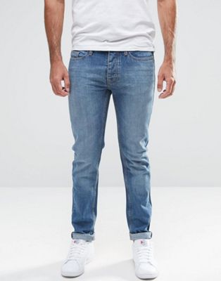 фото Темные джинсы в винтажном стиле с покрытием ldn dnm-синий