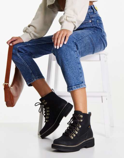 Teva lace up flat ankle hiker boots in black ASOS