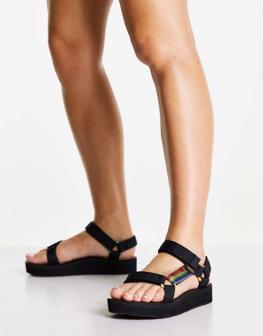 Teva Pride flat sandals in black and rainbow ASOS