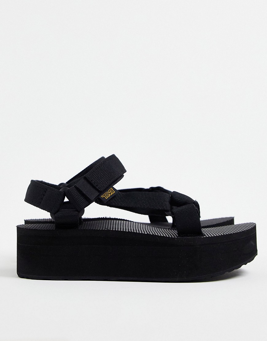 teva -  – Universal – Schwarze Flachform-Sandalen mit dicker Profilsohle