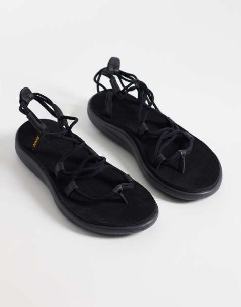 Teva Voya Infinity sandals in black - view 1