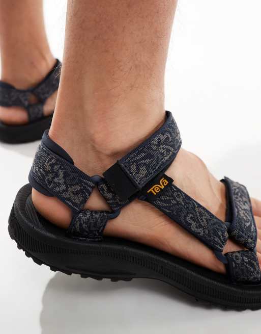 Teva Winsted sandals in navy retro print ASOS