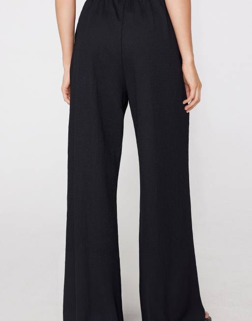 Tezenis Crinkle palazzo trousers in black, 2 of 5