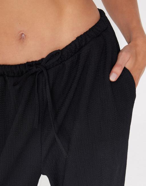 Tezenis Crinkle palazzo trousers in black, 3 of 5