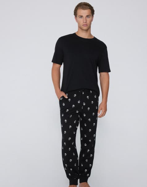 Tezenis Heavy printed joggers with pockets in black skulls print - view 1