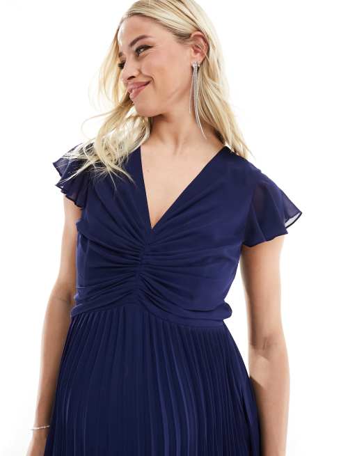 TFNC Maternity Bridesmaid chiffon maxi dress with flutter sleeve and pleated skirt in navy