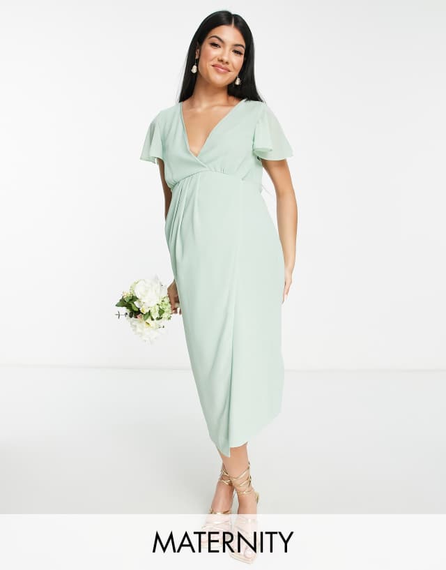 TFNC Maternity Bridesmaid chiffon wrap front midi dress with flutter sleeve in fresh sage