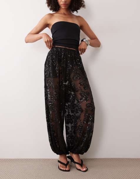 TFNC - pantalón negro de pierna globo con lentejuelas, transparente y cintura elástica de flores - view 1
