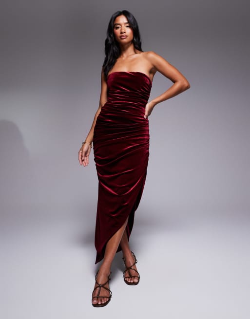 TFNC Petite ruched bandeau dress with uneven hem in burgundy velvet
