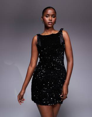 TFNC - Robe courte à sequins de qualité supérieure avec dos en V et nauds sur les épaules - Noir