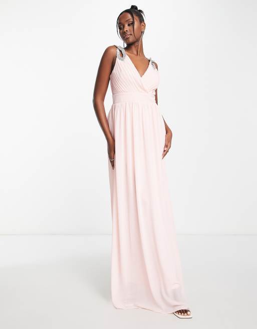 TFNC - Robe longue en mousseline pour demoiselle d'honneur avec épaules ornementées et détail croisé à l'avant - Rose évanescent