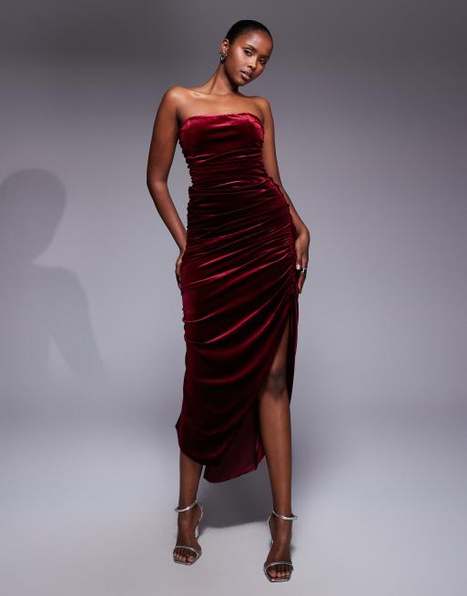 TFNC ruched bandeau dress with uneven hem in burgundy velvet